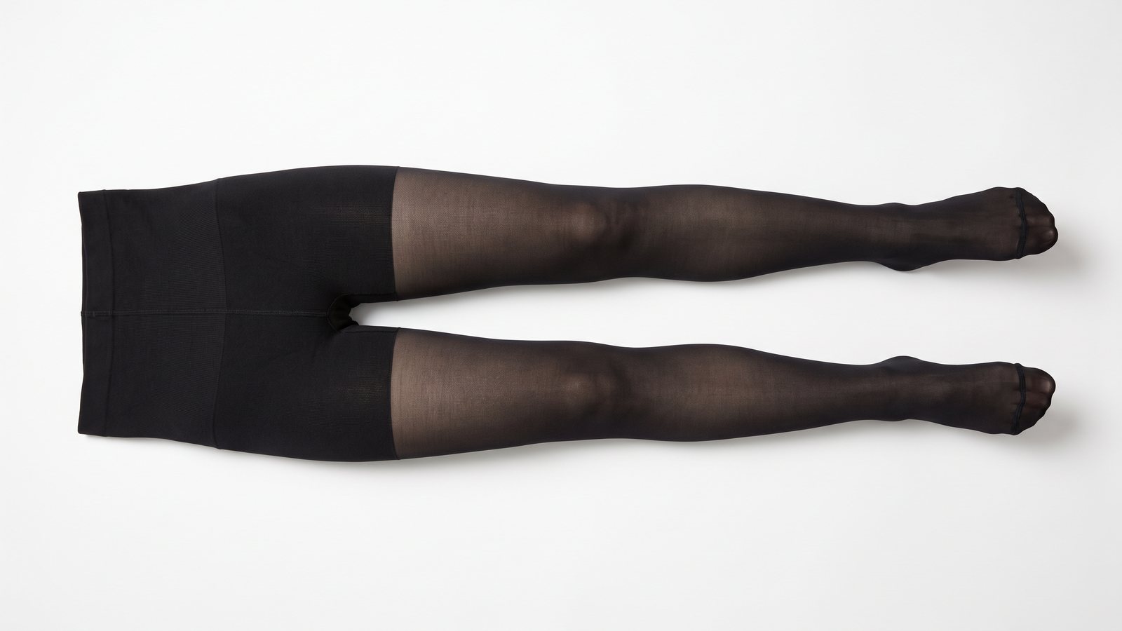 Shapewear-tights hybrid laid flat, opaque control panel above a sheer leg